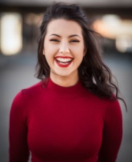 Woman in a red top smiling