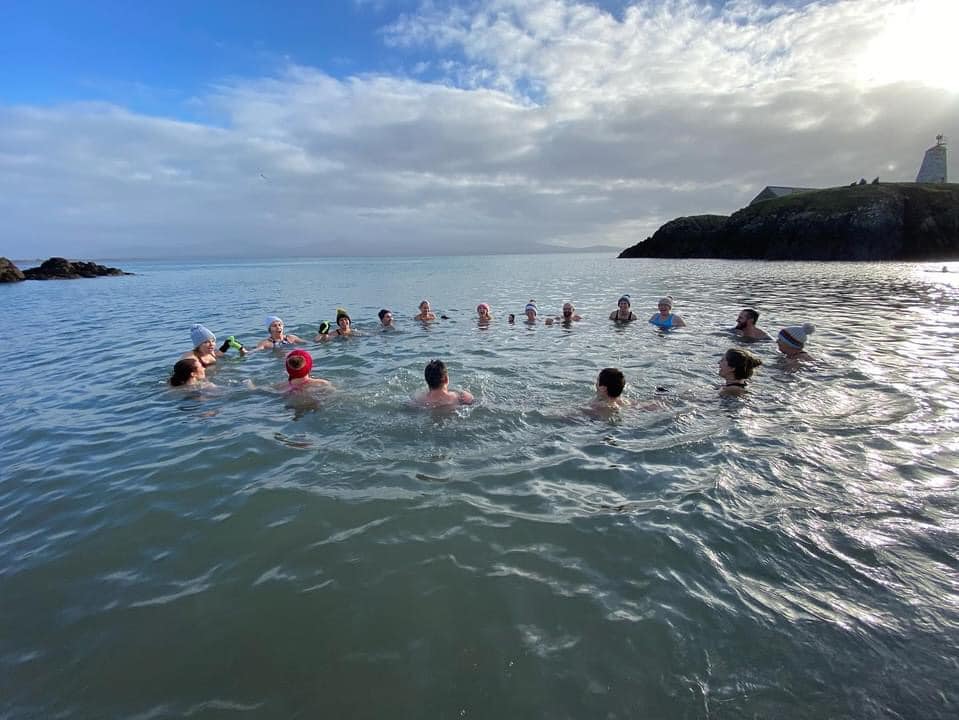 People swimming in a circle